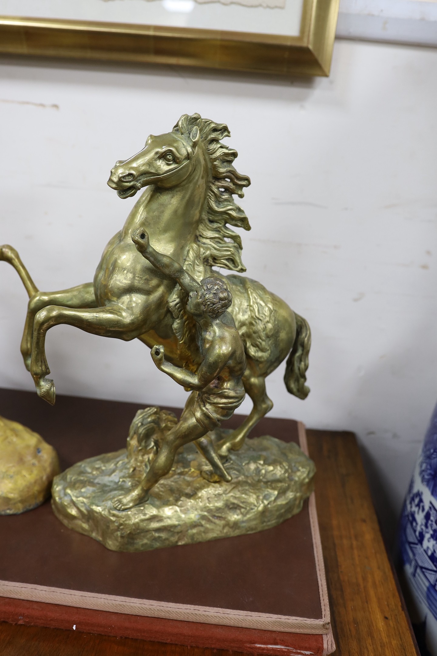 A pair of bronze Marly horses after Cousteau, 40cm high